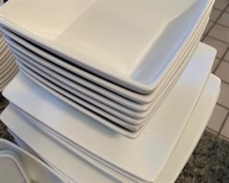 $35- Lot of white dishes by Target Home. Perfect for that college student heading to college in the fall! 8 dinner plates (10.25" across), 8 salad plates (8.25") 7 square bowls (6"), 5 larger square bowls (7.25"), circular bowls, smaller bowls, larger serving bowl and 6 coffee mugs.