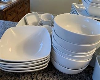 $35- Lot of white dishes by Target Home. Perfect for that college student heading to college in the fall! 8 dinner plates (10.25" across), 8 salad plates (8.25") 7 square bowls (6"), 5 larger square bowls (7.25"), circular bowls, smaller bowls, larger serving bowl and 6 coffee mugs.