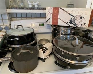 Now $40--$60- Large Lot of cookware; pots/pans of different sizes and condition, metal colander, knife sharpener, Mandoline, large George Foreman grill, electric knife. Keep what you want and send the rest with a college kid! 