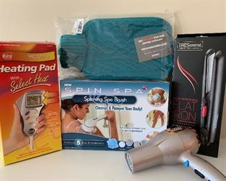$20 lot of personal handy items! Heating pad, spinning spa brush, hot water bottle, flat iron and a blow dyer 