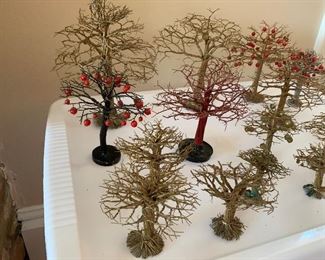 Now $40–$60-  Lot of decorative metal twist trees. 20 in total with the tallest measuring about 9.5" and the smallest one 2.5" tall.