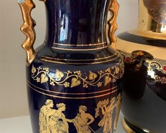 $15- two decorative vases. Small one has a small chip on handle which could be fixed with a dab of gold paint and measures 10.5" tall and the large one is glass and measures 14" tall with a 6.5" opening. 