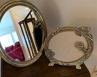 $24 -Art Deco mirror featuring a figural of a woman on the right side and a picture frame or mirror missing the glass. The mirror measures about 13" long buy 11" wide and the smaller one measures 9.5" across