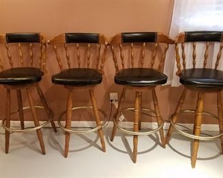$40- Set of 4 wood and black leather barstools. Measure 42" high and 20" width between arms, seat is 31" high. Scuffed wood on all upper wood chair back