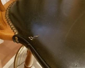 $40-Set of 4 wood and black leather barstools. Measure 42" high and 20" width between arms, seat is 31" high. Scuffed wood on all upper wood chair backs. 2 seats with slight damage 