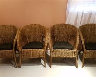 $30- Set of 4 wicker chairs with removable brown pads. 2 have slight damage. Measure 31"×24" seat height 17"