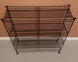 SOLD metal three-tiered shelf. (26"x9"x31")