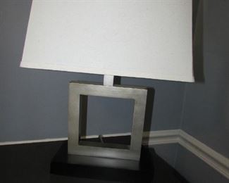 Contemporary resin lamp with shade. 14"w X 22.5"h X 9"d PRICE: $35.00