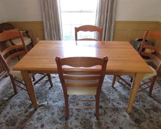 Arhaus Furniture dining table with (4) Arhaus side chairs. Table has butcher block-style top. Table dimensions: 36"w X 29.75"h X 60"l ; Chair dimensions: 19"w X 38"h X 16.5"d PRICE FOR SET: $595.00
