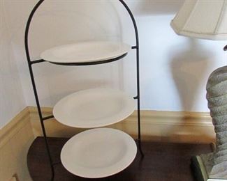 3-tier metal plate holder with (3) white glazed plates. 12"w X 23"h X 9.5"d PRICE: $20.00