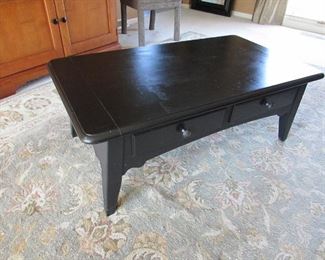 "Hammary" ebonized cocktail table with (2) drawers. 46"w X 16.75"h X 26"d. PRICE: $140.00