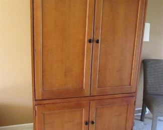 Nice solid wood entertainment center cabinet with interior power strip. 48"w X 74"h X 27"d PRICE: $50.00