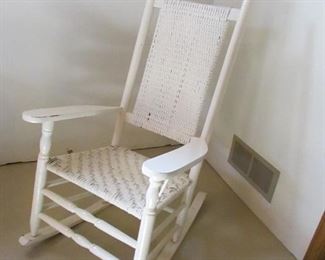 Vintage white painted woven rocker. 25.5"w X 44"h X 33"d with rocker PRICE: $40.00