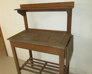 Potting table from World Market. 35"w X 51.5"h X 18"d PRICE: $75.00
