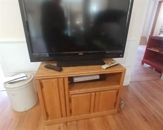 Flat screen TV with DVD player VHS player and stand $125