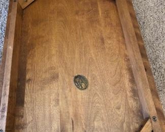 Bottom of end table showing Cushman medallion
