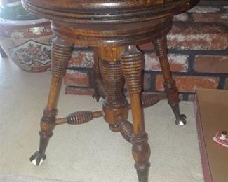 ANTIQUE SWIVEL STOOL WITH CLAW FEET
