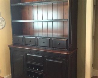 Matching black hutch with mahogany back measuring 5 feet wide by 7 1/2 feet tall $1,200.00
