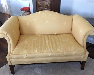 Camelback loveseat.   Has very nice detail.  A muted yellow color.  It is 57" wide, 30" deep and 34" high.  Asking price $325.   REDUCED TO $275. Taking 40% off ORIGINAL PRICE - NOW $195!
