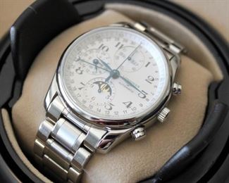 4. $1,850 - Longines Master Collection Chronograph Automatic Moon Phase With White Dial L2.673.4 - Excellent condition, runs, serial number 34413323, includes box, case, instructions, warranty