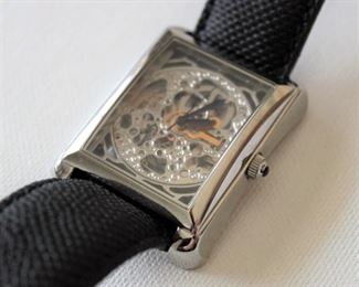 7. SOLD - Akribos XXIV Skeleton Watch - Excellent condition, runs, minor wear and tear, genuine snake band, box