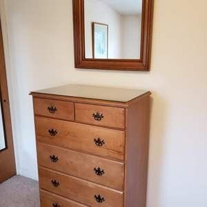 Nice Highboy style Antique Dresser with wall mirror. This dresser also has a glass topper. 