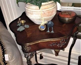 One of two matching 2-tier side tables; one of two floral arrangements