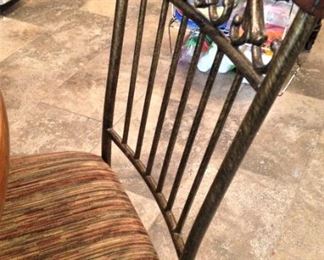 Each chair has an upholstered seat.