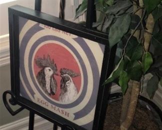 Rooster picture on an ease; artificial plant