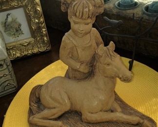 Little girl and colt statue
