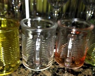 Four small glass mugs