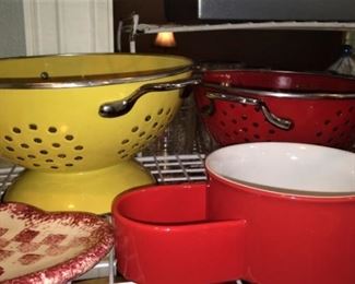 Yellow and red colanders 
