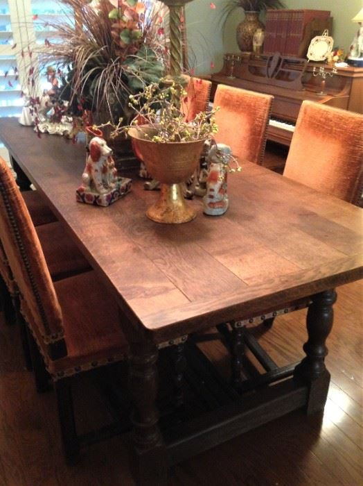 Antique table and orange upholstered chairs