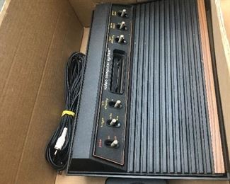 Vintage six switch atari with joystick and cord