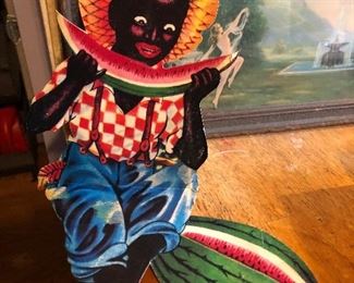 - Vintage die cut cardboard black Americana display - folds in to a “pop-up” sitting boy with fruit. (We have about 9 of these)