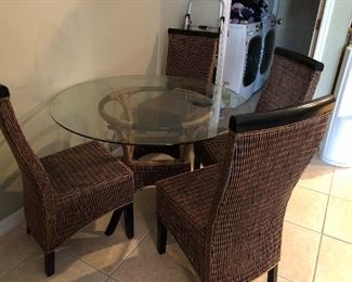 Glass top table with 4 chairs AS IS $150.00  Dimensions:  45 diameter x 29 high.  chairs 40 high  seat 16x18...floor to seat 18.  Paint on chairs