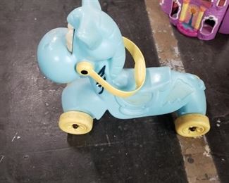 Vintage plastic riding horse on wheels $15