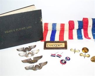 Lot 18. WWII Military Lot. (4) pilot wings-2 are marked sterling, Pilots Flight Log and assorted military pins $250