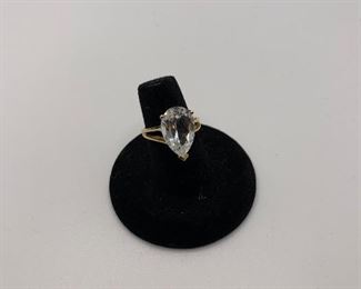 Size 6 14K 3.7g TW While this is not a diamond, it is a beautiful large faceted pear shaped stone with a faint blue tint $450.00 #246