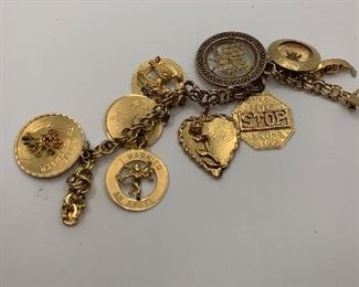 14K Charm Bracelet with 14K charms. Some are jeweled with diamonds and gemstones. It is 7.5 inches long and weighs just over 60 grams  TW $2250.00 #253