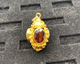  14K 10.3g TW Charm with 4 garnet colored stones  $350 #258