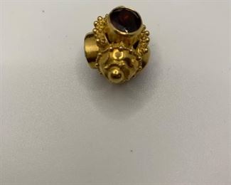  14K 10.3g TW Charm with 4 garnet colored stones  $350 #258