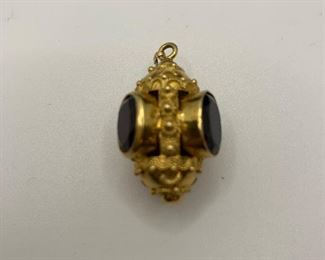  14K 10.3g TW Charm with 4 garnet colored stones  $350 #258