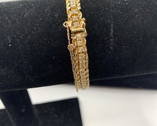 18k yellow gold diamond tennis bracelet  with gold rope edging 
 17.5 g TW 
4 carat total diamond weight 
GH color VS1 clarity
(Appraised at $8374) $3750 #300