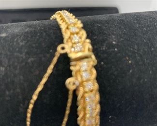 18k yellow gold diamond tennis bracelet  with gold rope edging 
 17.5 g TW 
4 carat total diamond weight 
GH color VS1 clarity
(Appraised at $8374) $3750 #300
