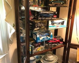 Cabinet, collectibles and dishes