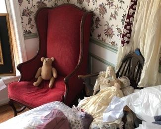 Fabric chair and antique dolls