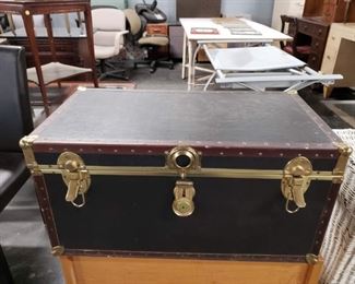 Vintage Black Vinyl with brass hardware trunk Measures: 31.25"W x 17"D x 15.5"H closed Call 