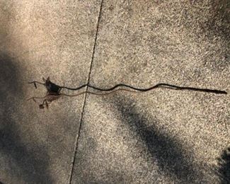 Rust patina yard art of nest with bird.
5 ft tall 
$20