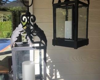 2 metal and glass candle holders 18” tall, with 2 flame less candles.
$45